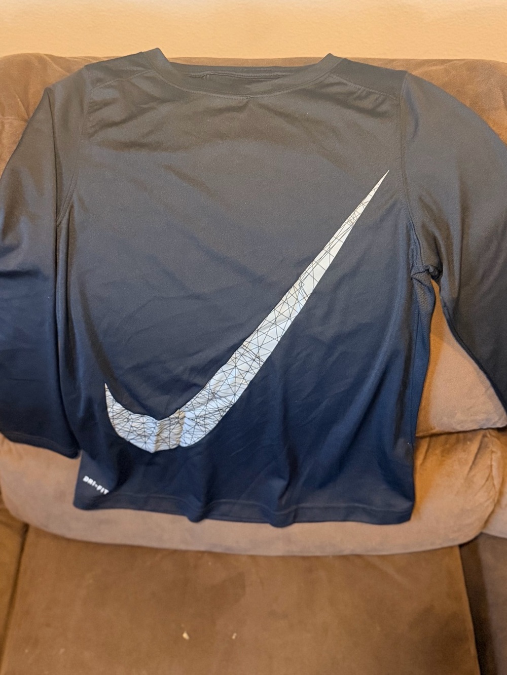 Nike Black Long Sleeve Top with Large Silver Swoosh Accent